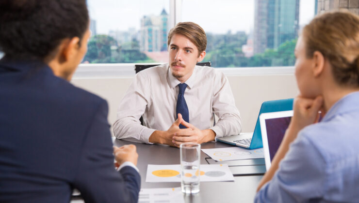 Business Leader Listening to Team Recruitment Agency in Greece