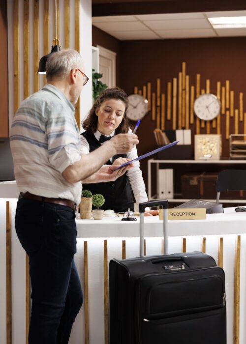 tourist-checks-front-desk-hotel