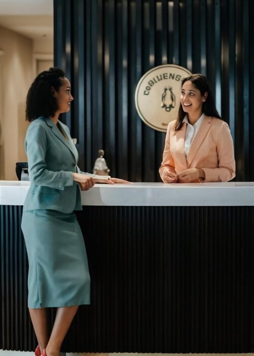 woman-talking-with-hotel-receptionist